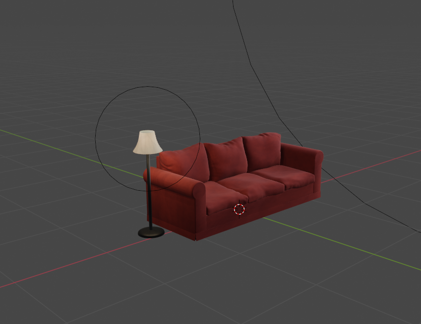 Red couch, seen from far away, against a dark grey background